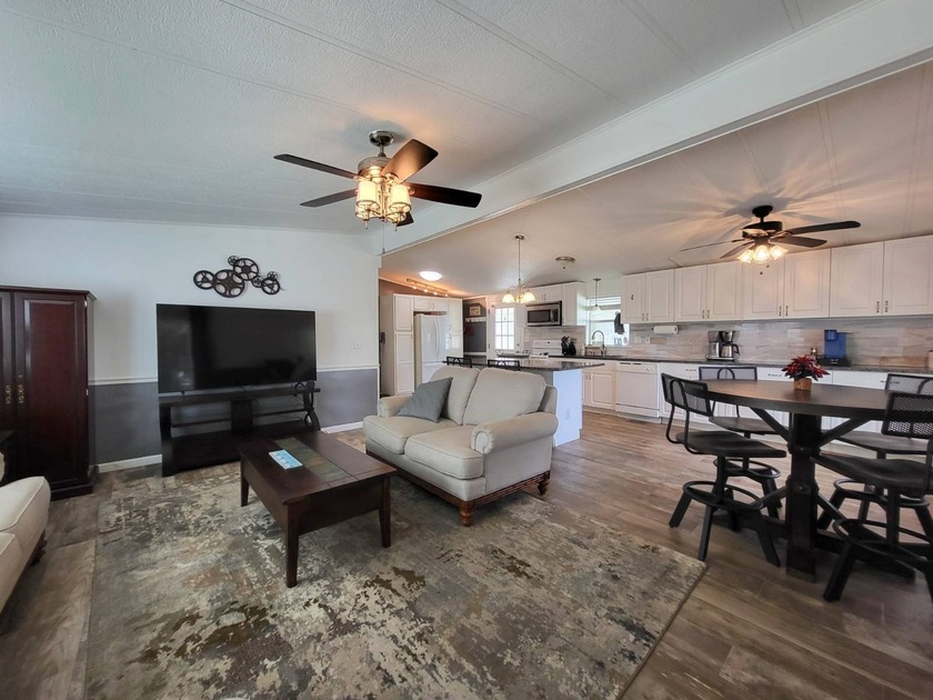 FURNISHED AS PICTURED AND EZ-GO GAS GOLF CART INCLUDED! This - Beach Home for sale in Sarasota, Florida on Beachhouse.com