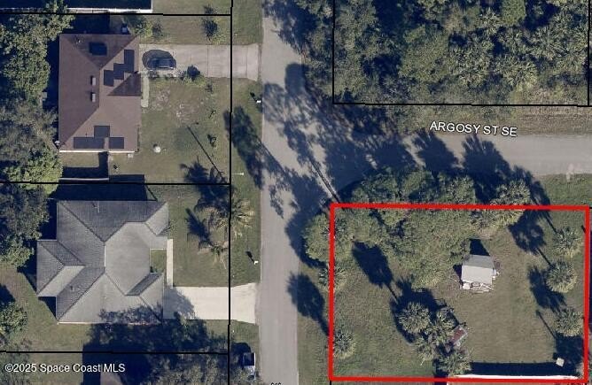 Only a few trees remain on this spacious corner lot at Haskell - Beach Lot for sale in Palm Bay, Florida on Beachhouse.com
