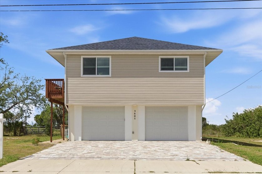 Experience elevated coastal living at its finest in this - Beach Home for sale in Hernando Beach, Florida on Beachhouse.com