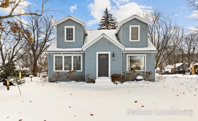 This 4-bedroom, 2-bath home is move-in ready with all the charm - Beach Home for sale in Spring Lake, Michigan on Beachhouse.com
