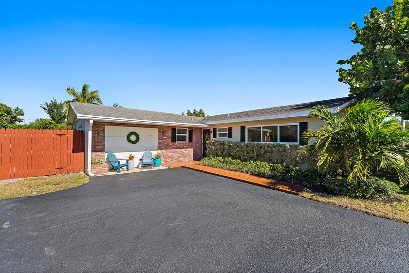 Positioned on an oversized corner lot in Lake Clarke Shores - Beach Home for sale in Lake Clarke Shores, Florida on Beachhouse.com