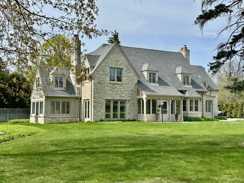 This stately stone Tudor is located  east of Lake Drive, just - Beach Home for sale in Fox Point, Wisconsin on Beachhouse.com