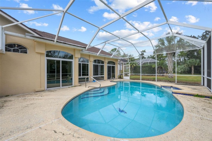 Canal-Front Home with Dock and Screened Pool--Your Waterfront - Beach Home for sale in Palm Coast, Florida on Beachhouse.com