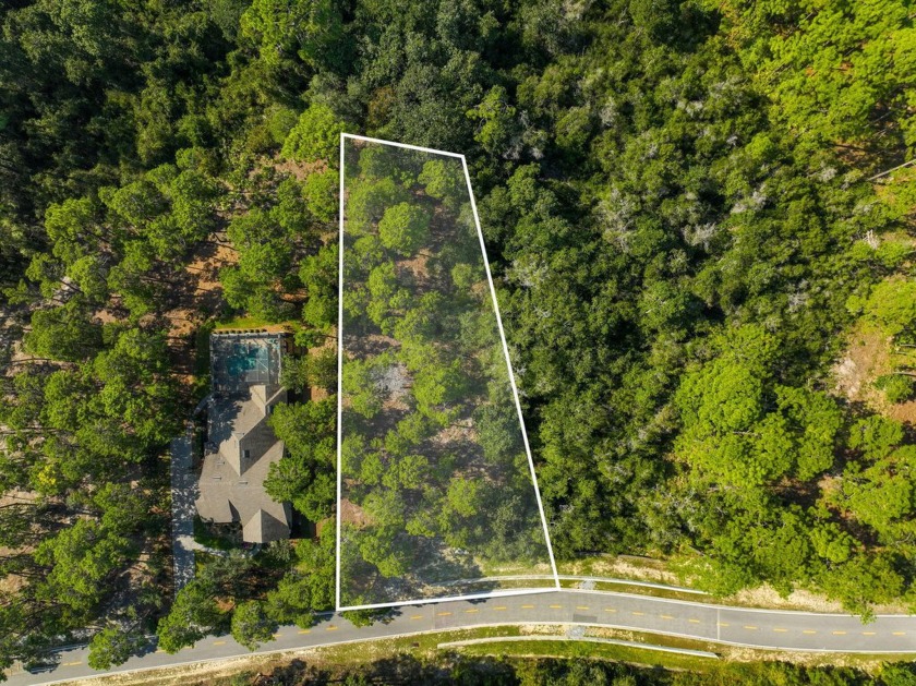 This .55-acre vacant lot is located in the gated Wild Heron - Beach Lot for sale in Panama City Beach, Florida on Beachhouse.com