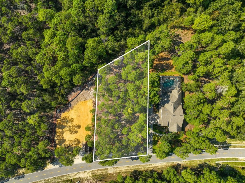 This .5-acre vacant lot is located in the gated Wild Heron - Beach Lot for sale in Panama City Beach, Florida on Beachhouse.com