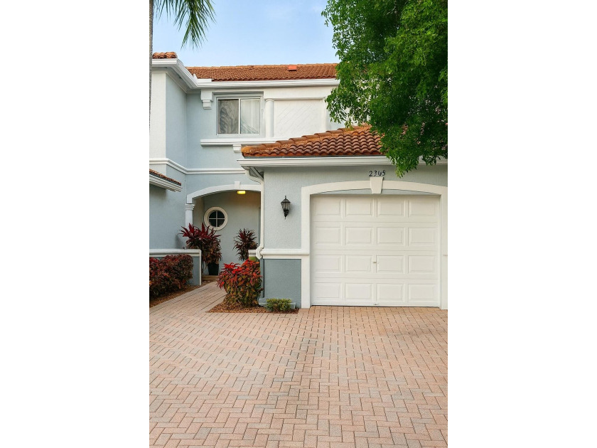 Welcome to comfortable living in the gated community of Thousand - Beach Townhome/Townhouse for sale in Riviera Beach, Florida on Beachhouse.com