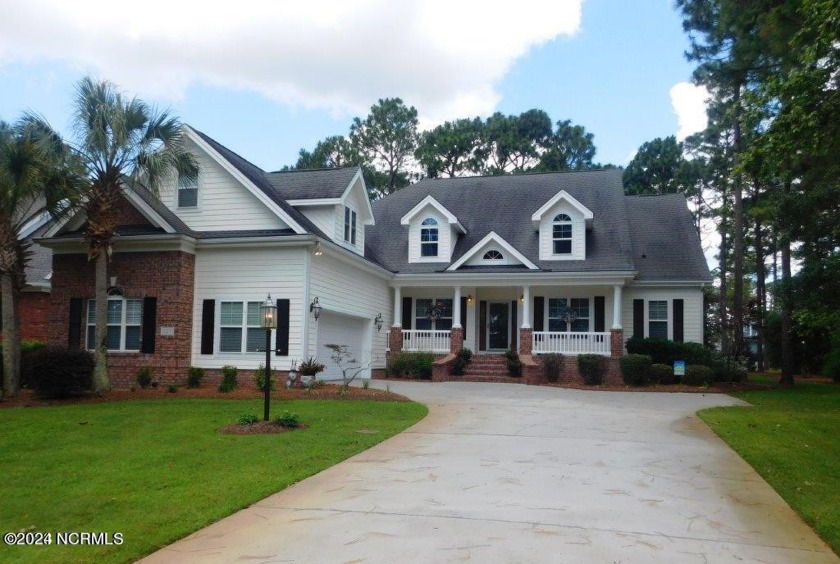 Welcome to this stunning 4-bedroom, 3-bathroom home with a - Beach Home for sale in Sunset Beach, North Carolina on Beachhouse.com