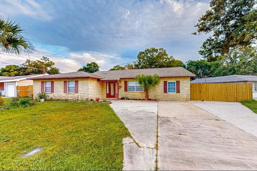 This 3-bedroom, 2-bath pool home with a versatile bonus room is - Beach Home for sale in Tampa, Florida on Beachhouse.com