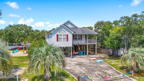 Experience the essence of coastal living in this Oak Island - Beach Home for sale in Oak Island, North Carolina on Beachhouse.com