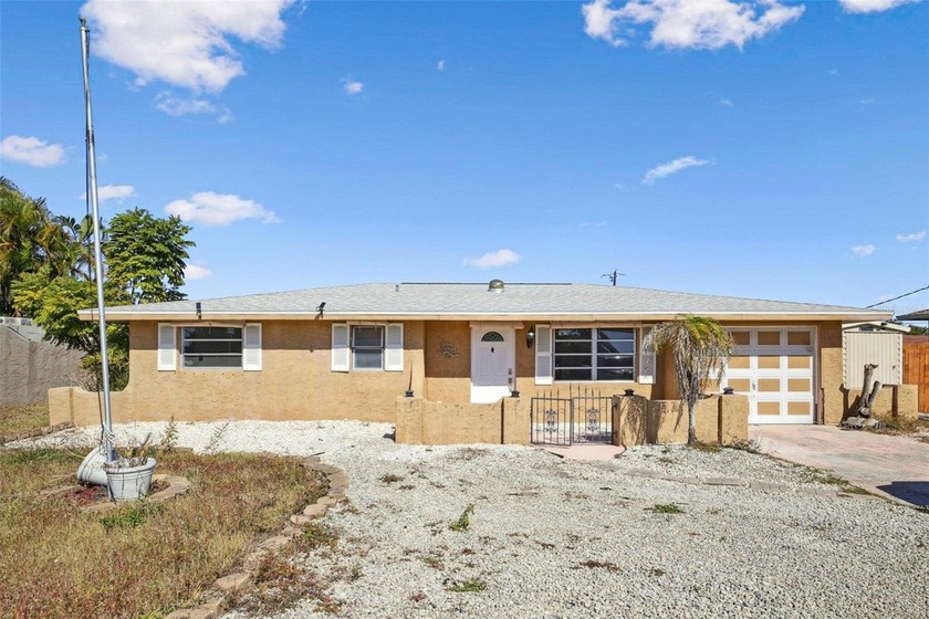 Discover this charming residence located on Edgewater Drive in - Beach Home for sale in Port Charlotte, Florida on Beachhouse.com