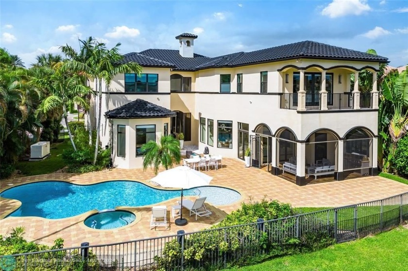 Discover the epitome of lakefront luxury at 17934 Monte Vista - Beach Home for sale in Boca Raton, Florida on Beachhouse.com