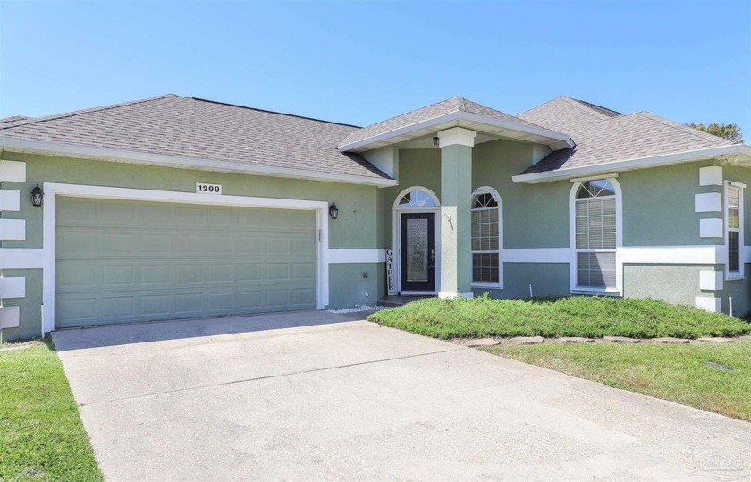 Stunning waterfront stucco home features three bedrooms, two - Beach Home for sale in Gulf Breeze, Florida on Beachhouse.com