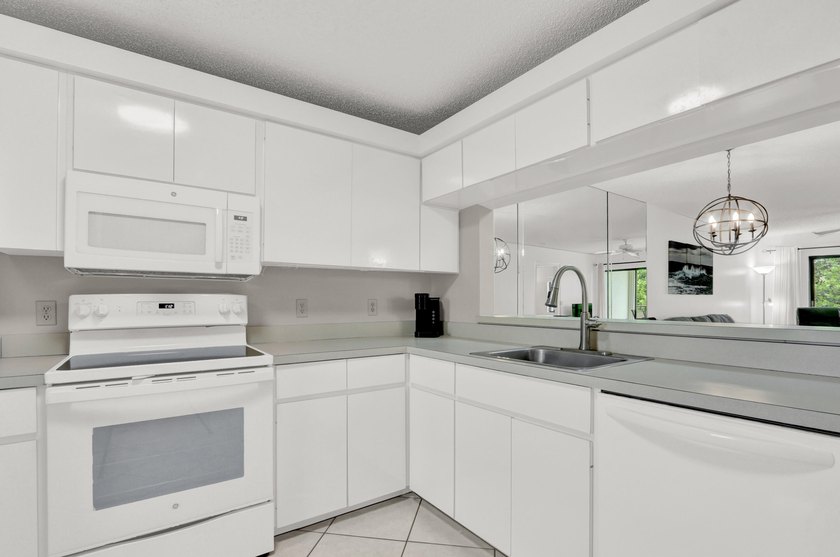 Steps from the beach, this inviting residence at 115 Bamboo Rd - Beach Condo for sale in Palm Beach Shores, Florida on Beachhouse.com