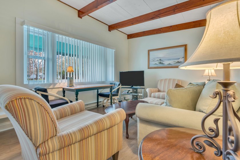 This fully furnished corner unit at Holiday House Condominiums - Beach Condo for sale in Wells, Maine on Beachhouse.com