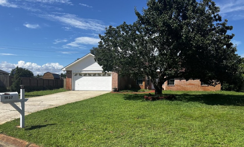 Nestled within the picturesque sound-side community of Sandy - Beach Home for sale in Navarre, Florida on Beachhouse.com