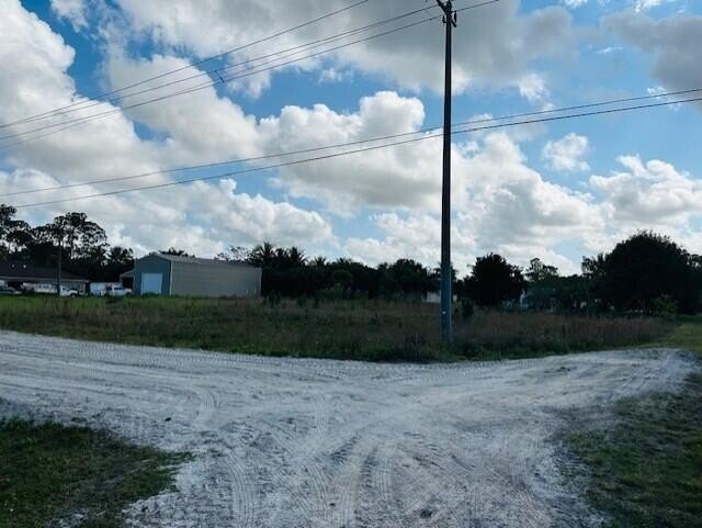 This expansive 1.31-acre corner lot offers an ideal location for - Beach Lot for sale in West Palm Beach, Florida on Beachhouse.com