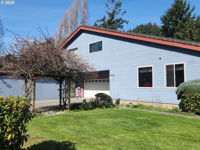 Step outside and fall in love with your expansive grassy lawn - Beach Home for sale in Gold Beach, Oregon on Beachhouse.com