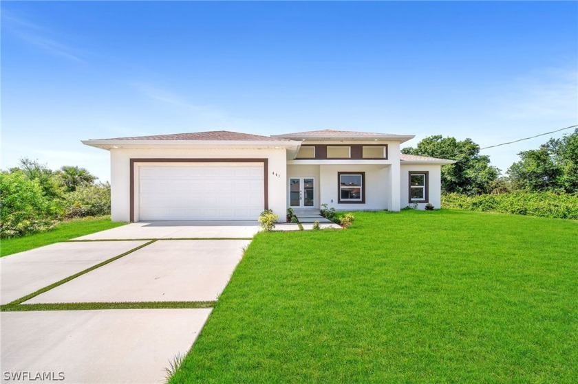 This stunning, newly constructed 4-bedroom, 2-bathroom residence - Beach Home for sale in Lehigh Acres, Florida on Beachhouse.com