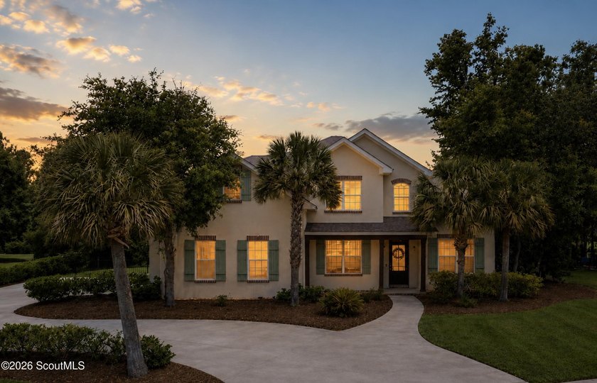 Situated on a spacious lakefront corner lot in Carriage Gate - Beach Home for sale in Brunswick, Georgia on Beachhouse.com
