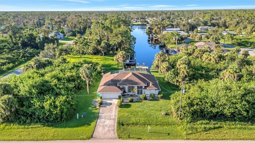 Experience waterfront living at its finest. This beautifully - Beach Home for sale in Port Charlotte, Florida on Beachhouse.com