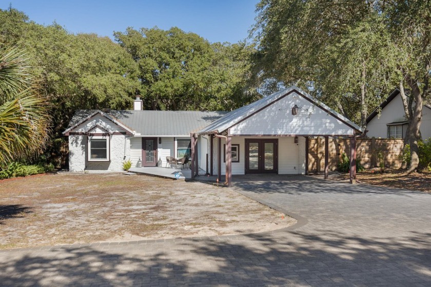 Nestled on an oversized lot graced by heritage oaks, this - Beach Home for sale in Inlet Beach, Florida on Beachhouse.com