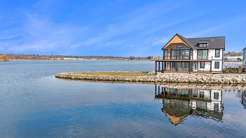 Experience lakefront living on your private peninsula with - Beach Home for sale in Whitehall, Michigan on Beachhouse.com