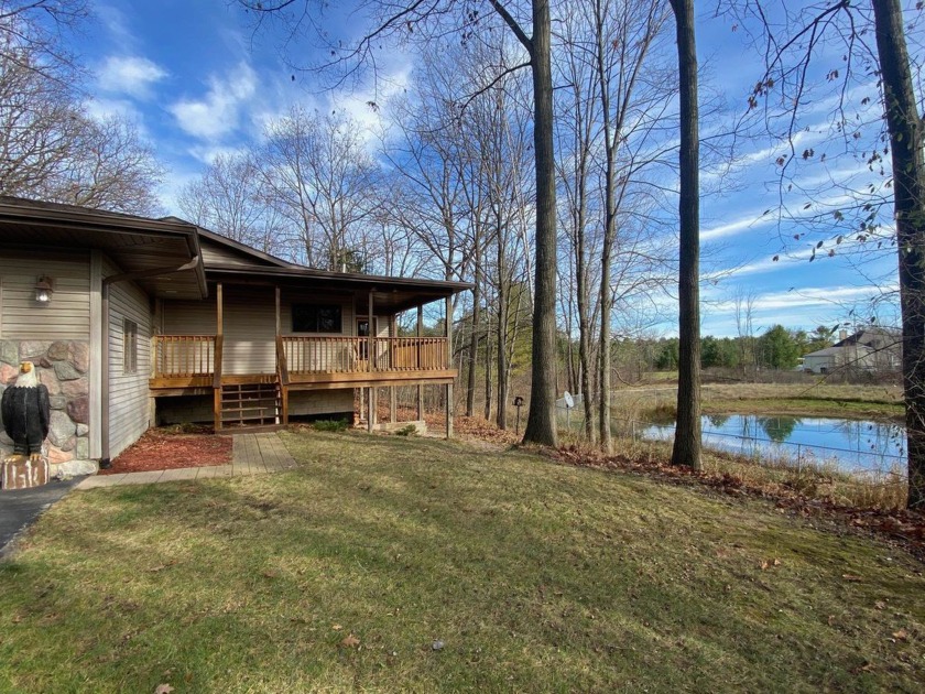 Set on a beautiful wooded 8+ acre lot this nicely updated 5 - Beach Home for sale in Standish, Michigan on Beachhouse.com