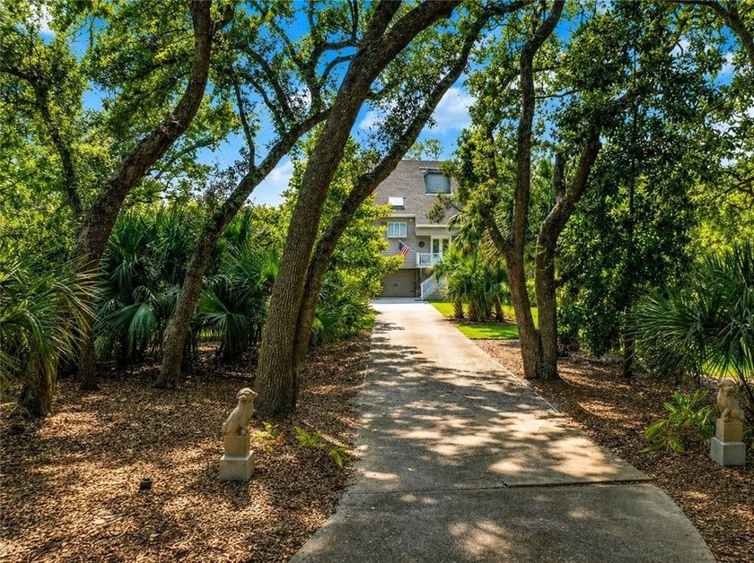 Tucked away on a **private marsh-front lot**, 207 Military Rd is - Beach Home for sale in Saint Simons, Georgia on Beachhouse.com