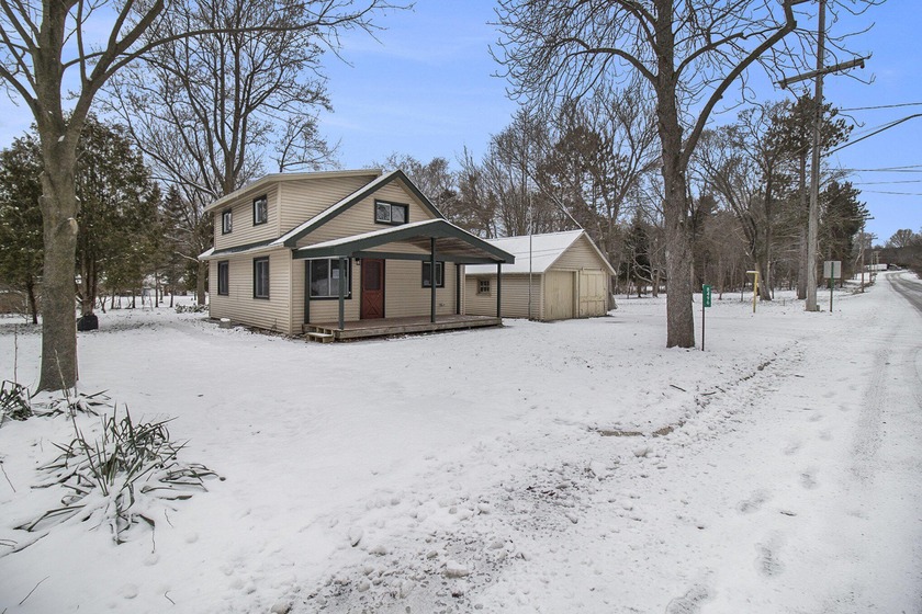 Fully Renovated in 2024! This sweet village farmhouse has been - Beach Home for sale in Onekama, Michigan on Beachhouse.com