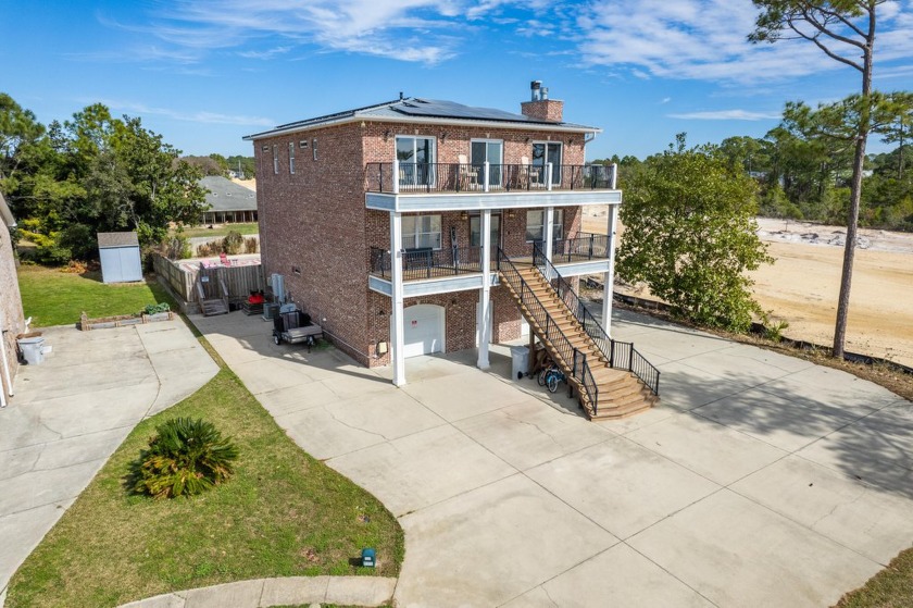 Welcome to Schooner Court, all brick, three story home that - Beach Home for sale in Navarre, Florida on Beachhouse.com