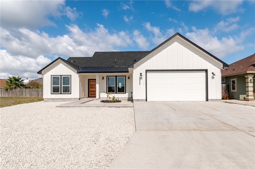 Step into island luxury with this stunning 4-bedroom, 3-bath - Beach Home for sale in Corpus Christi, Texas on Beachhouse.com