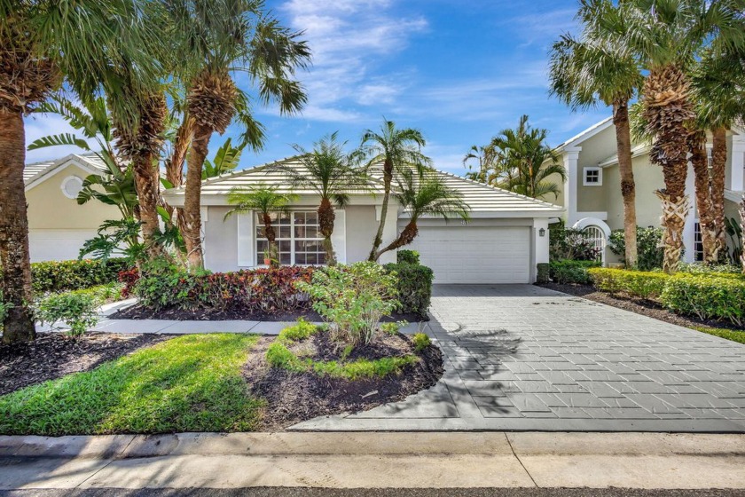 This stunning home is nestled on a serene lake in a highly - Beach Home for sale in West Palm Beach, Florida on Beachhouse.com