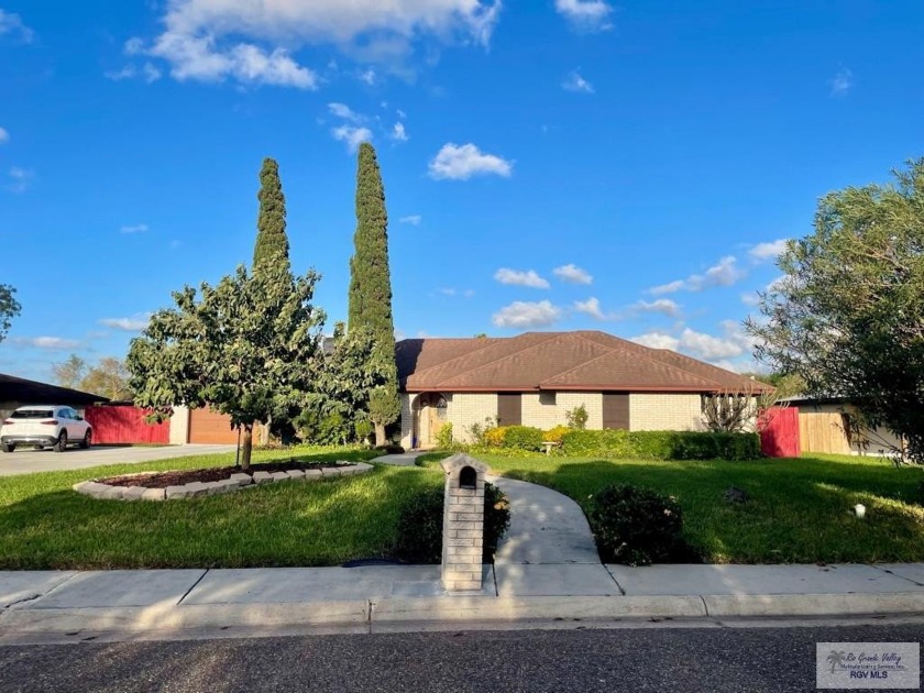 This stunning home, nestled on a beautifully landscaped 0.5-acre - Beach Home for sale in Brownsville, Texas on Beachhouse.com