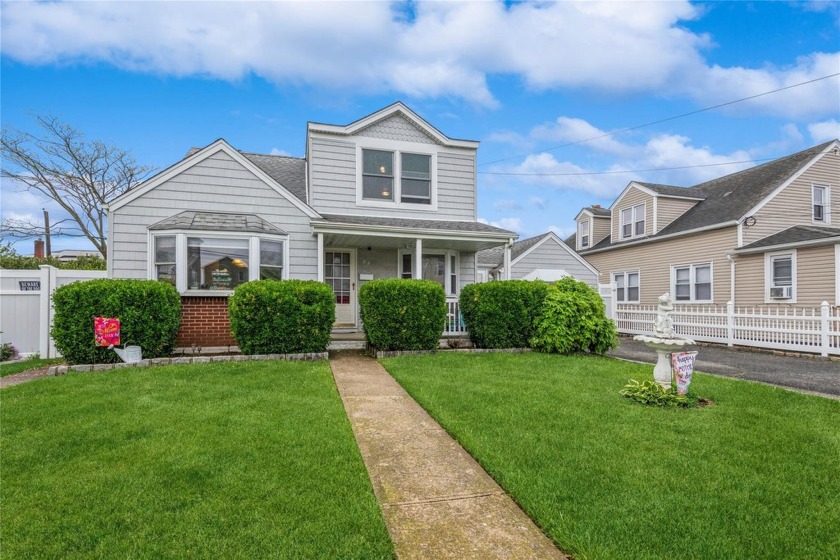 Welcome to this beautiful two-family home in the heart of Island - Beach Townhome/Townhouse for sale in Island Park, New York on Beachhouse.com