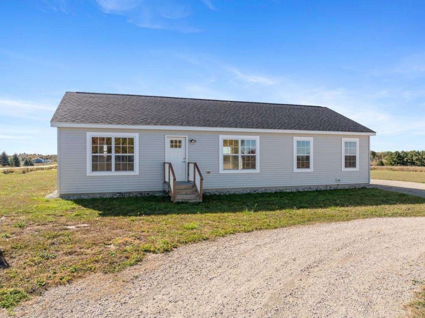 This charming 2021-built home on nearly 2 acres in Charlevoix is - Beach Home for sale in Charlevoix, Michigan on Beachhouse.com