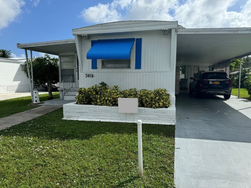 This charming singlewide mobile home in the desirable 55+ - Beach Home for sale in Pompano Beach, Florida on Beachhouse.com