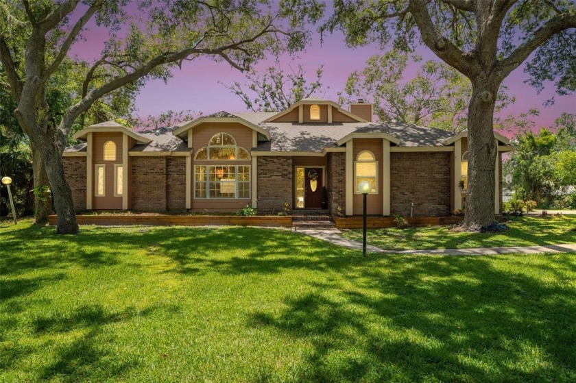 Welcome to this stunning 4-bedroom, 2.5-bath lakefront home - Beach Home for sale in Sarasota, Florida on Beachhouse.com