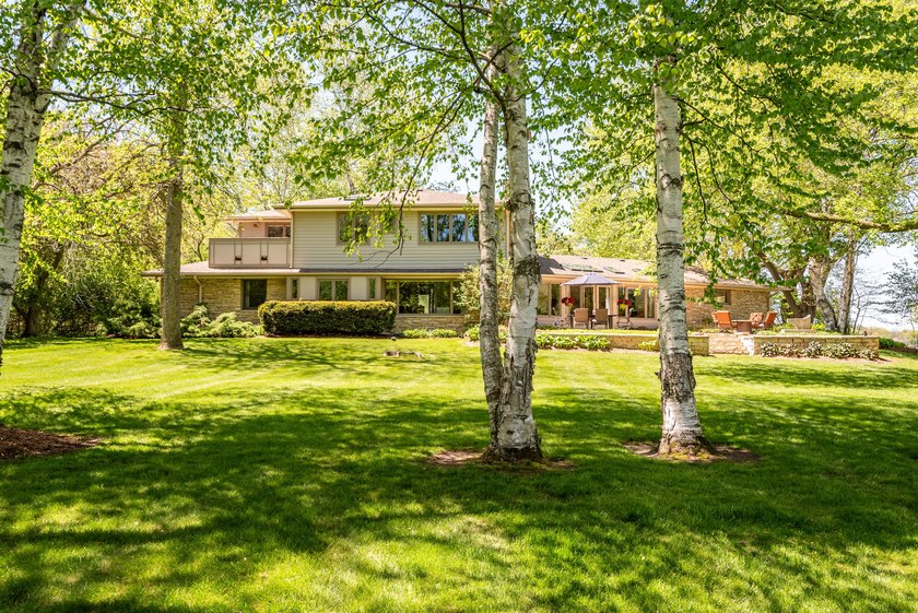 Captivating riverfront home set on two stunning acres nestled - Beach Home for sale in Mequon, Wisconsin on Beachhouse.com
