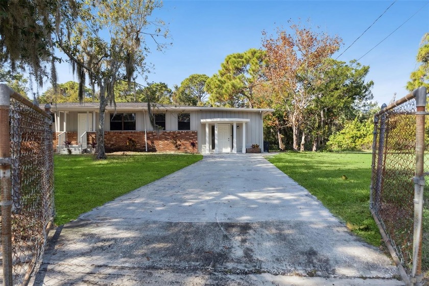 Nestled in a serene, sought after neighborhood, this beautifully - Beach Home for sale in New Smyrna Beach, Florida on Beachhouse.com