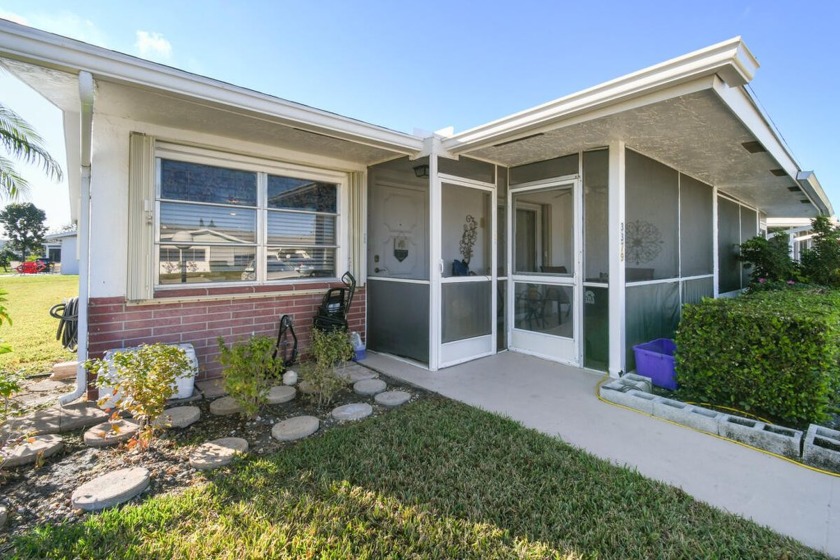 Don't miss out on this remarkable corner villa in the - Beach Home for sale in West Palm Beach, Florida on Beachhouse.com