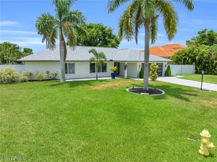 Sitting on a  1/2  acre, discover this beautifully upgraded 3 - Beach Home for sale in Fort Myers, Florida on Beachhouse.com