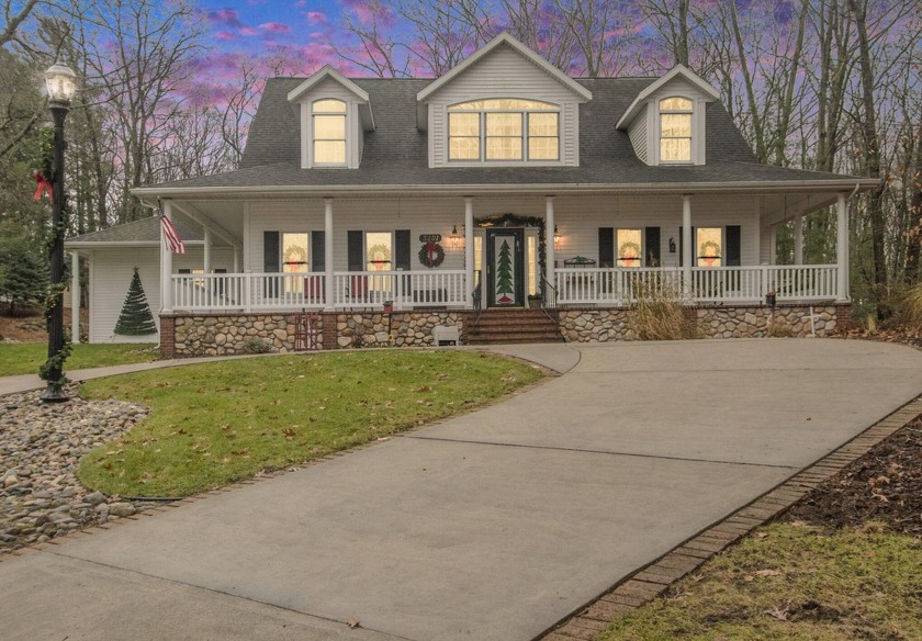 This stunning farmhouse-style home offers a wrap around porch - Beach Home for sale in Muskegon, Michigan on Beachhouse.com