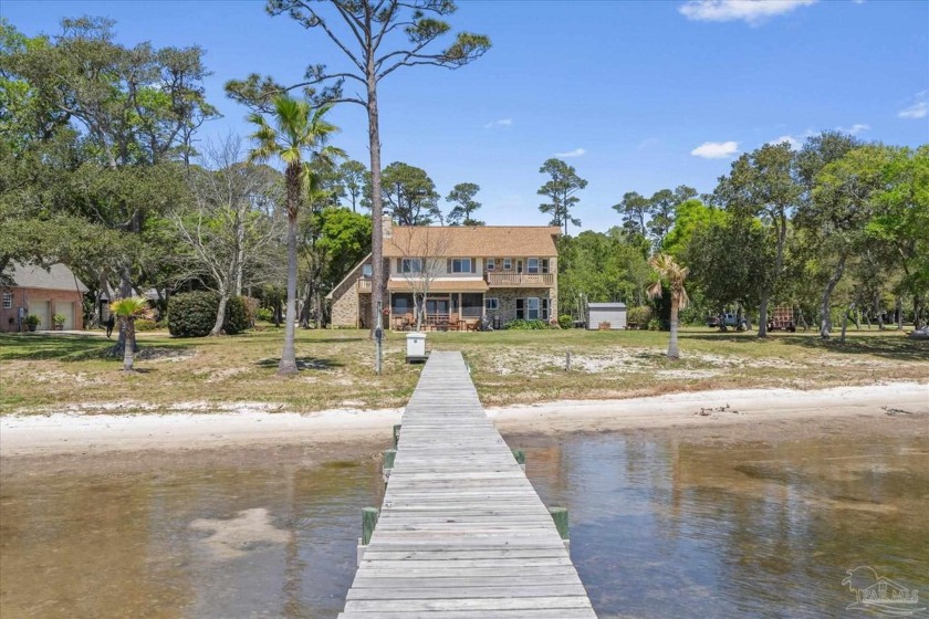 This is a LOT OF HOUSE on a HUGE WATERFRONT LOT, waiting for - Beach Home for sale in Gulf Breeze, Florida on Beachhouse.com
