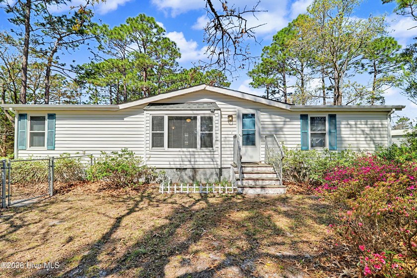 Tucked among the towering pines of Boiling Spring Lakes, this - Beach Home for sale in Southport, North Carolina on Beachhouse.com