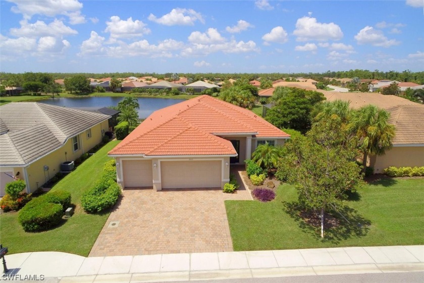 3-car garage and beautiful lake views! This spacious 4-bedroom - Beach Home for sale in North Fort Myers, Florida on Beachhouse.com