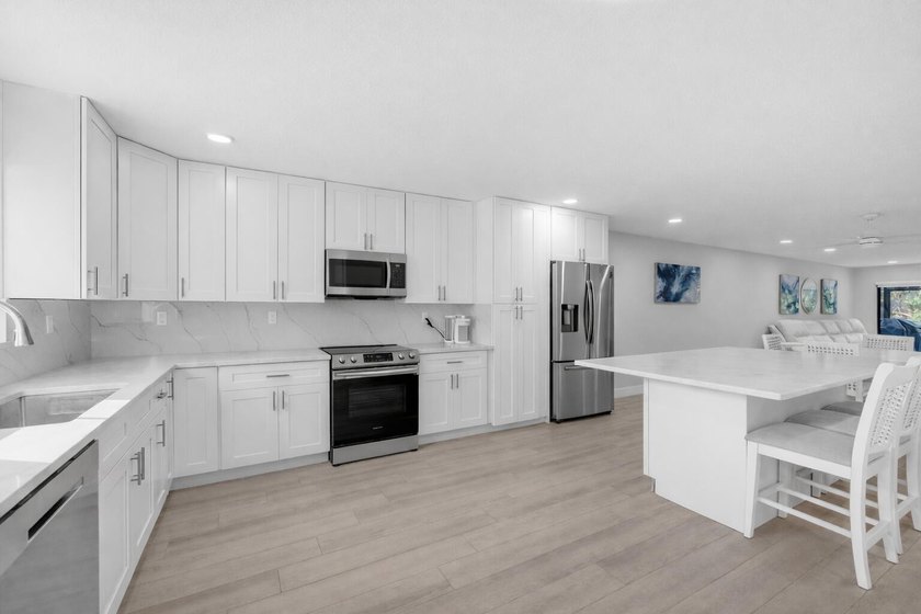 A fully renovated, white-and-bright coastal contemporary retreat - Beach Condo for sale in Jupiter, Florida on Beachhouse.com