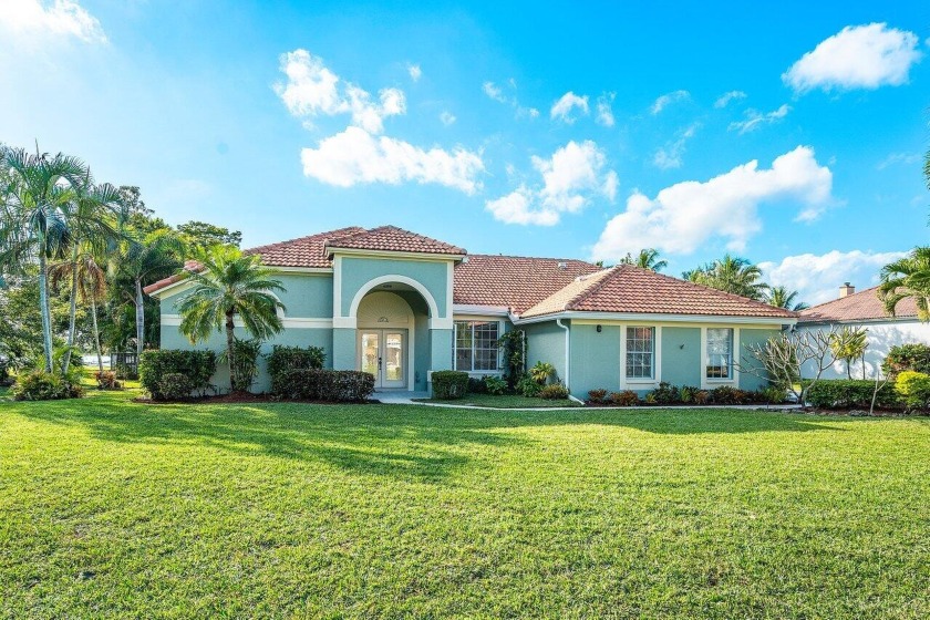 This exquisite four-bedroom, three-bathroom single-story home is - Beach Home for sale in Lake Worth, Florida on Beachhouse.com