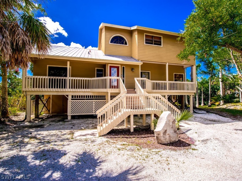 This exceptional 4-bedroom, 3-bathroom family home is ideally - Beach Home for sale in Sanibel, Florida on Beachhouse.com