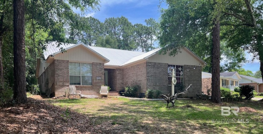 Welcome to this charming Coastal brick home nestled into a - Beach Home for sale in Lillian, Alabama on Beachhouse.com