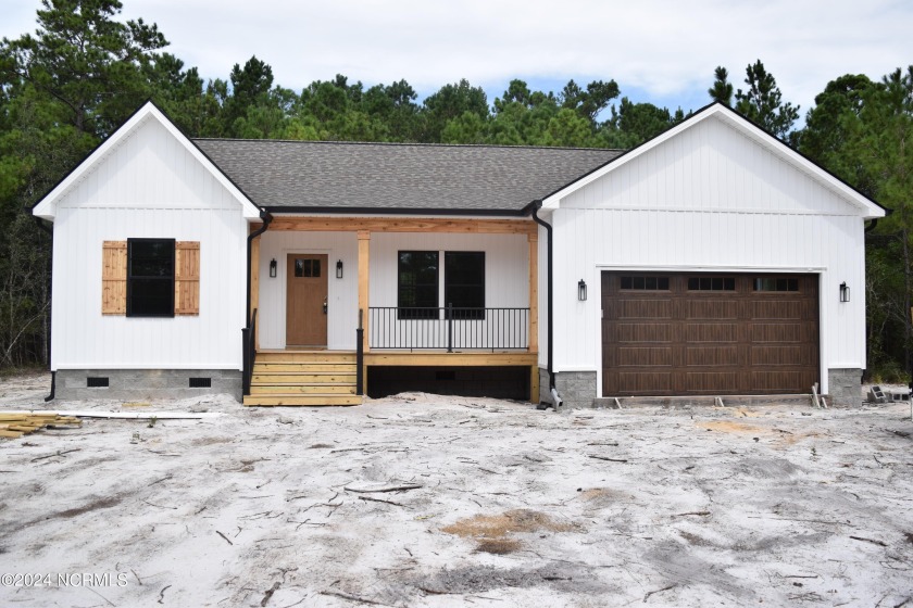 Experience coastal living in this meticulously crafted new - Beach Home for sale in Shallotte, North Carolina on Beachhouse.com